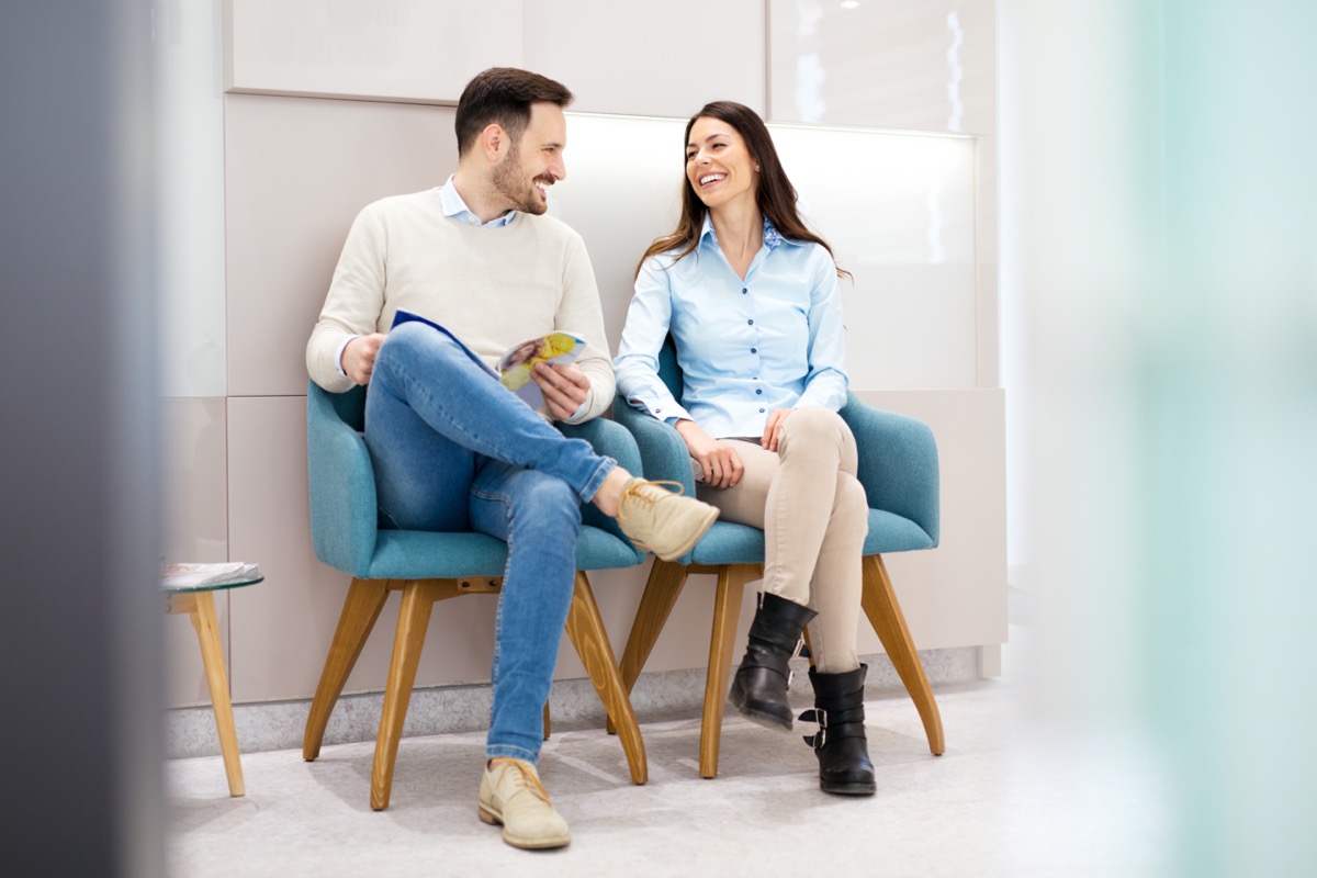 Couple talking in waiting room