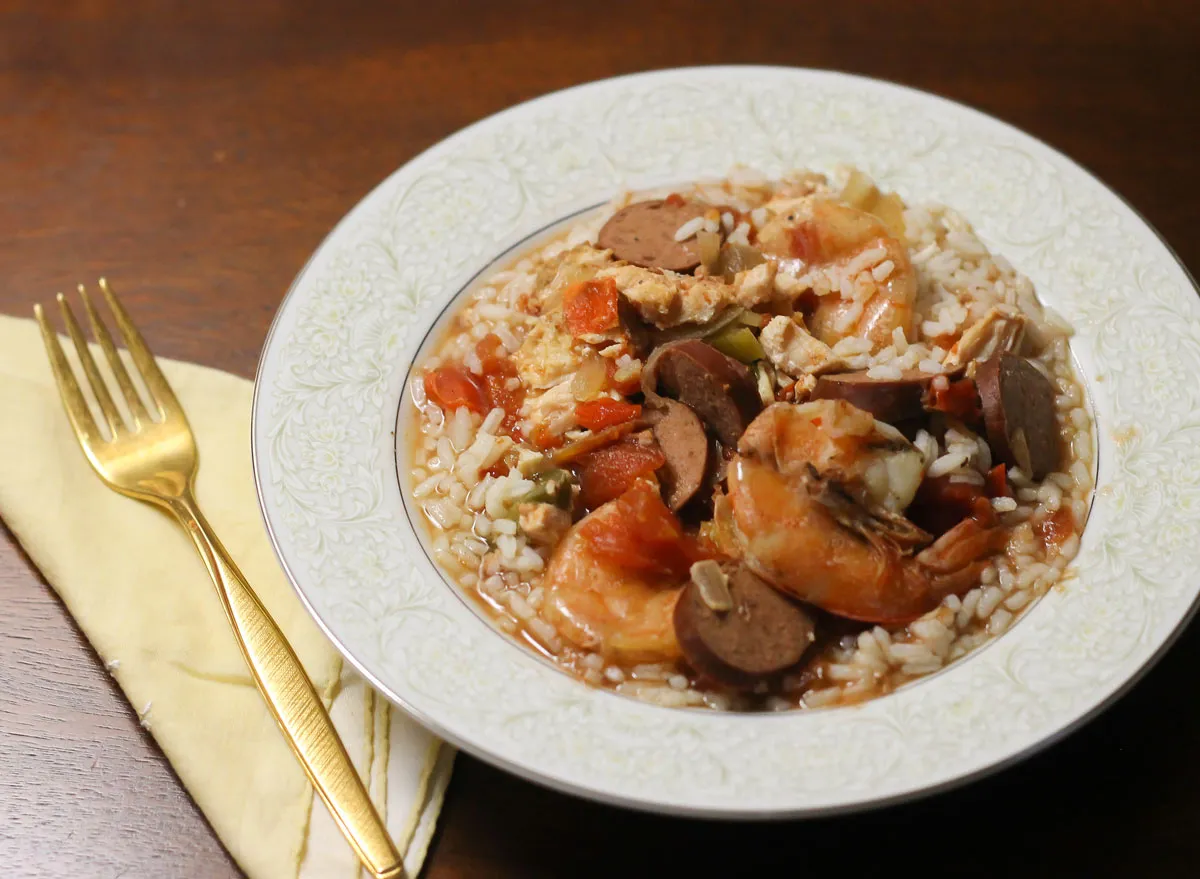 Crock pot jambalaya in a bowl on a bed of rice ready to eat.