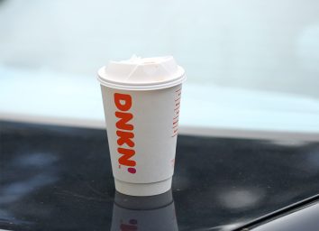 dunkin coffee cup on table