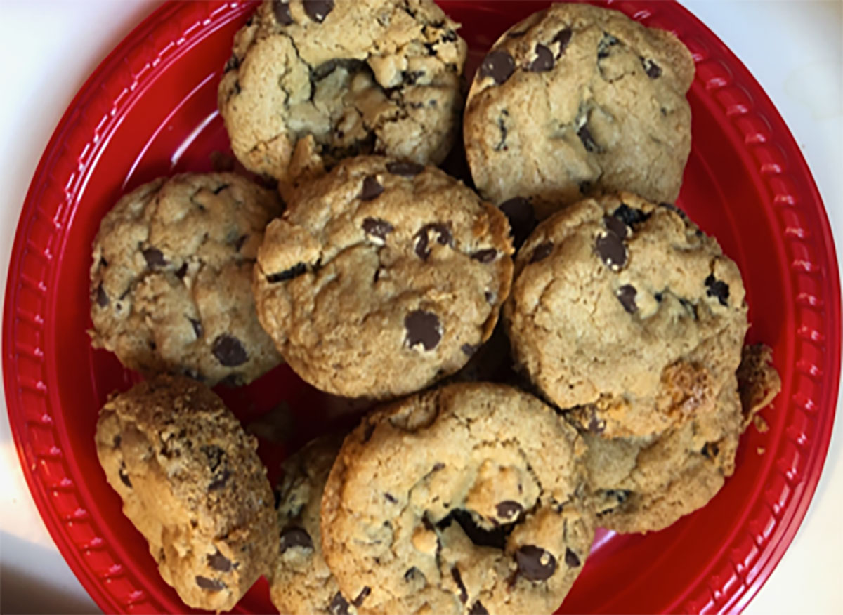 dylan lauren chocolate chip cookies on red plate