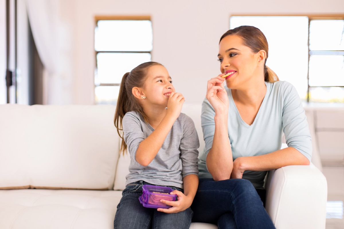 child and mother eating crackers, gluten-free snacks