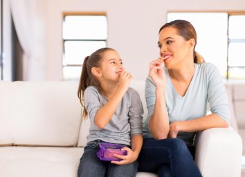 child and mother eating crackers, gluten-free snacks