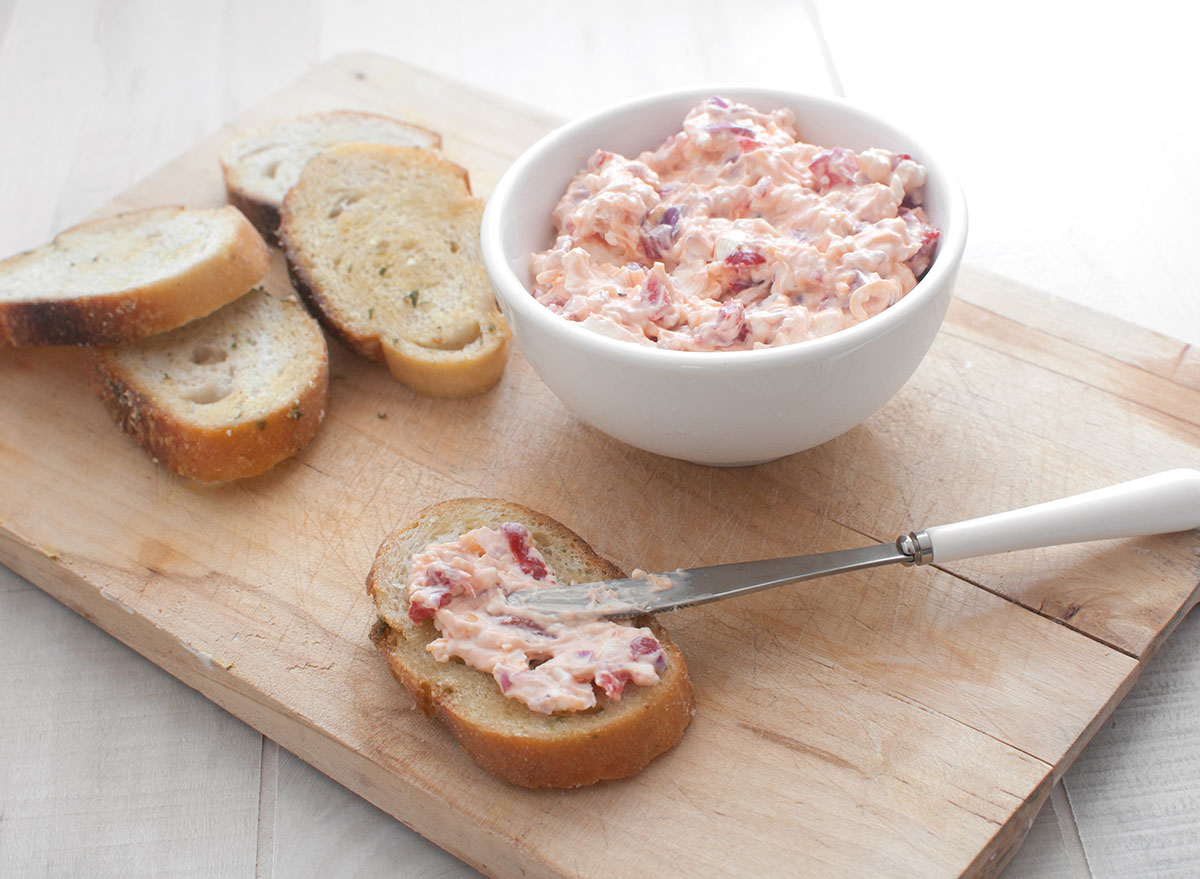 pimento cheese bread spread with knife