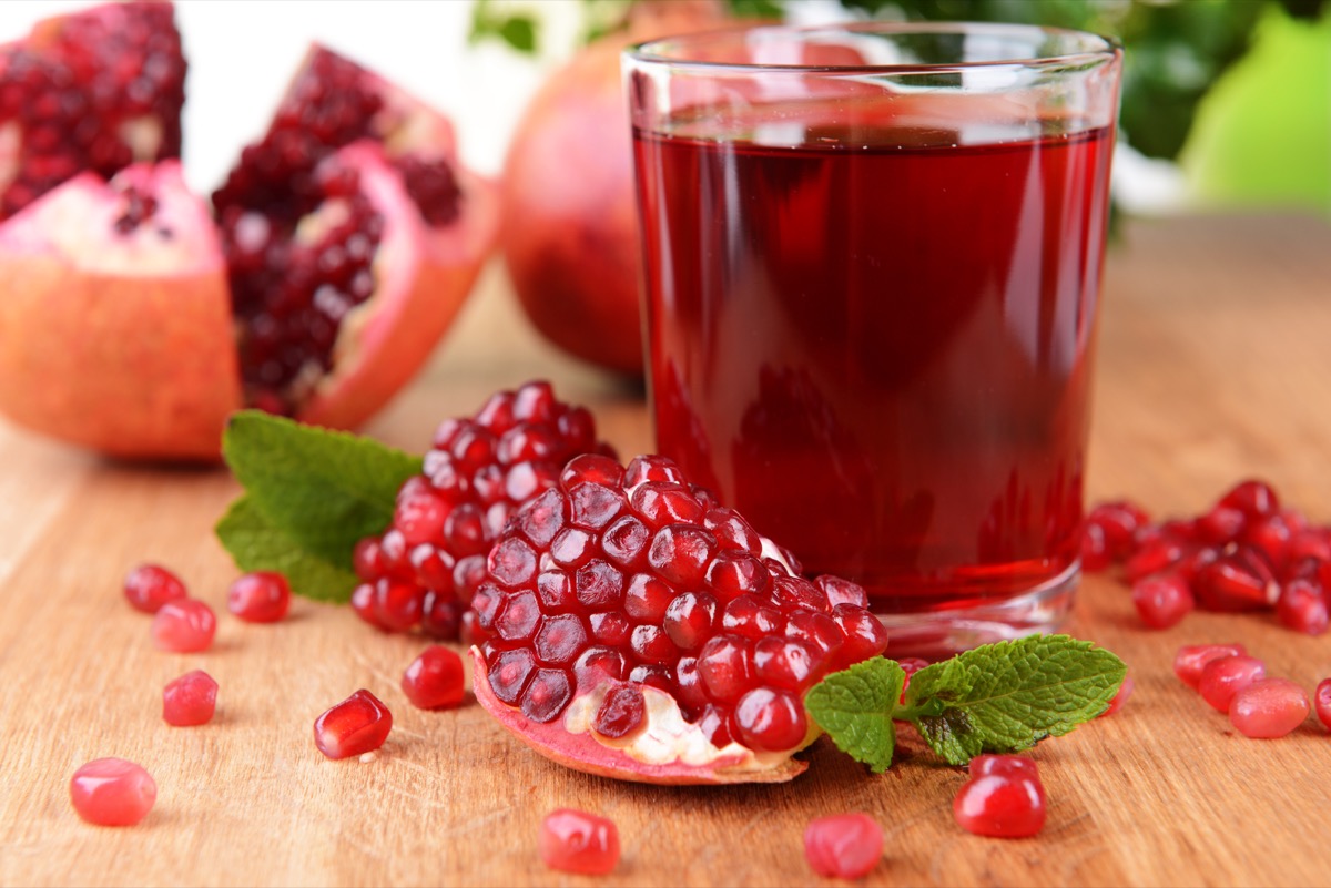 pomegranates with juice on table