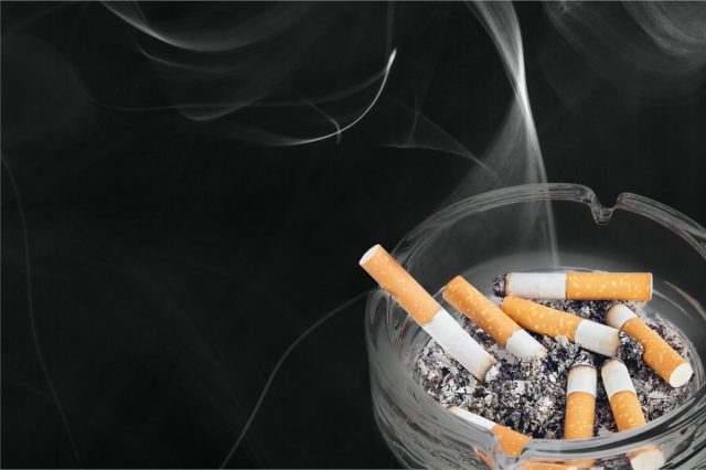 Cigarettes in ashtray.