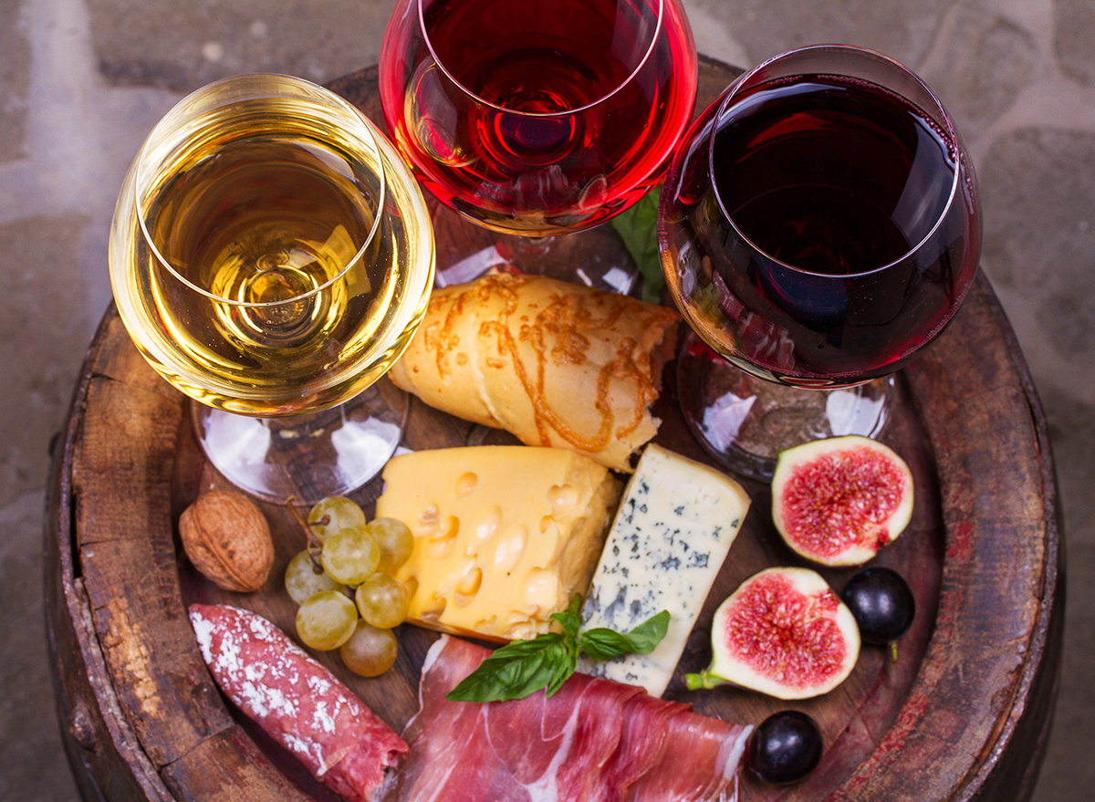 7 Side Effects of Eating Too Much Cheese, According to Experts Eat