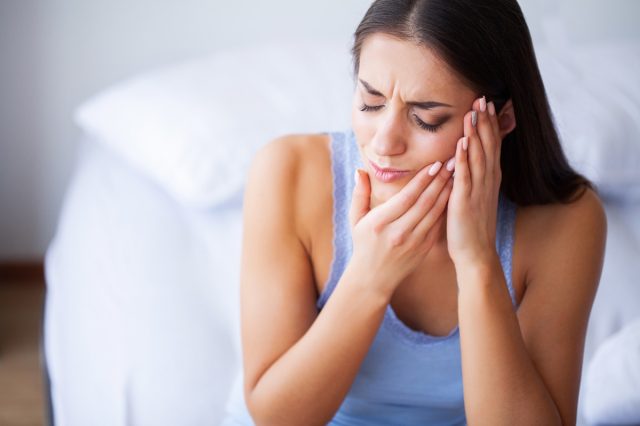 Woman Suffering From Painful Toothache
