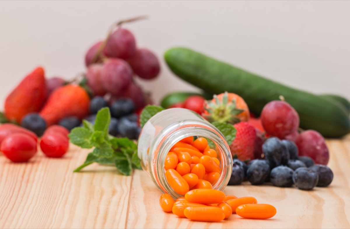 pills and vegetables on a table