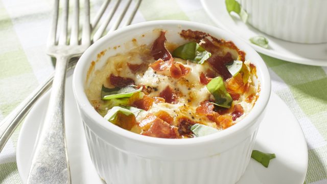 baked eggs in cream with prosciutto parmesan basil