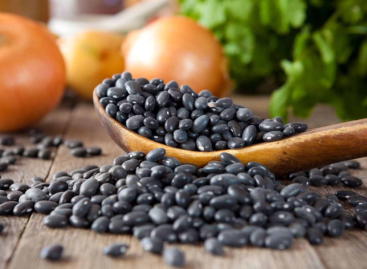 black beans in wooden spoon