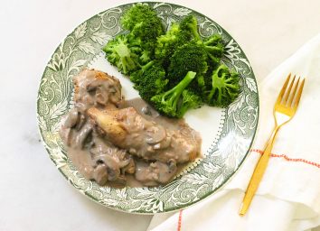 Copycat Carrabba's chicken marsala with steamed broccoli on a plate