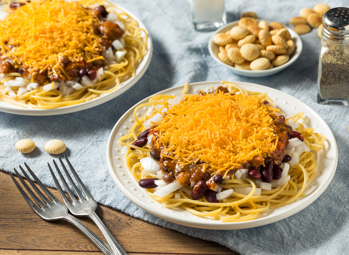 plates of cincinnati chili topped with cheddar cheese