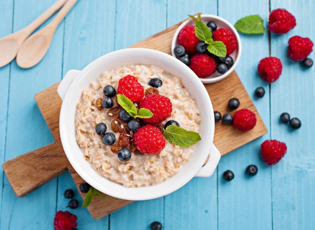 Oats with berries in a white bowl