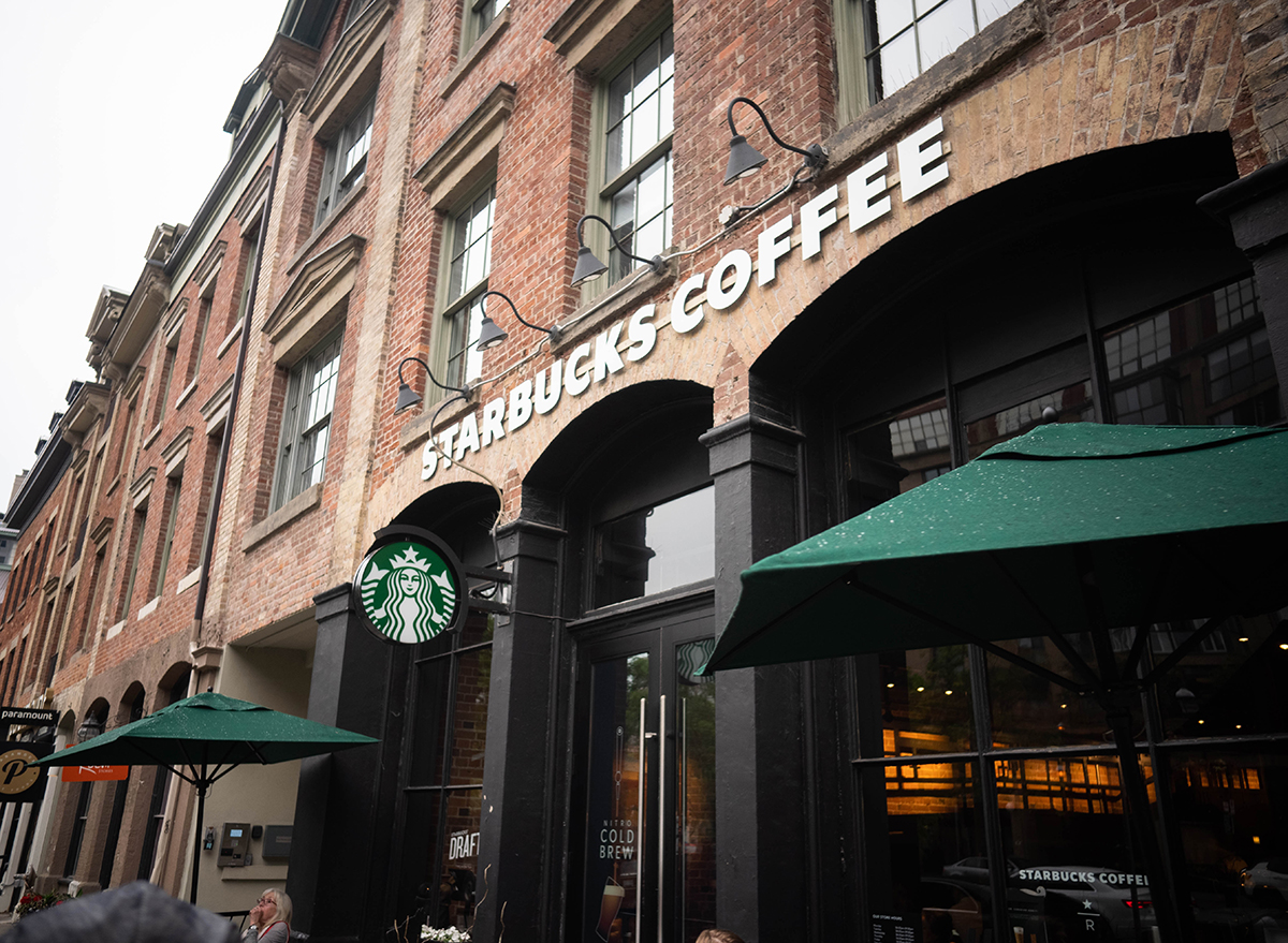 Outside starbucks with green umbrellas