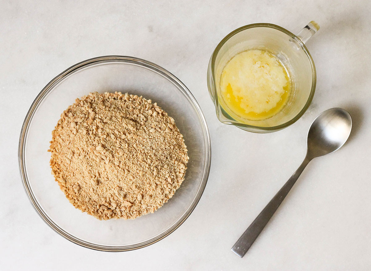 Combining graham cracker crumbs with butter