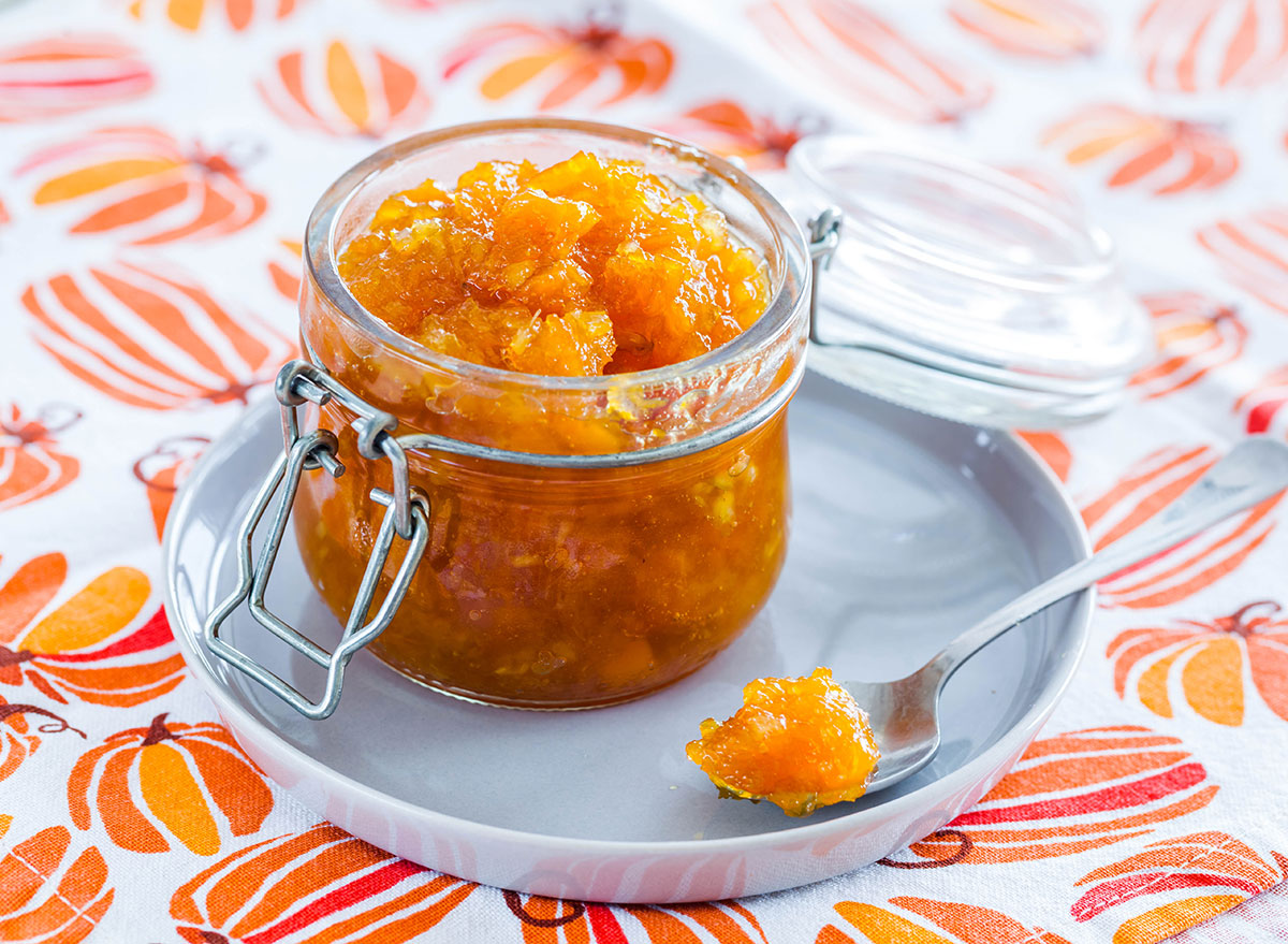 pumpkin in jar on plate with spoon