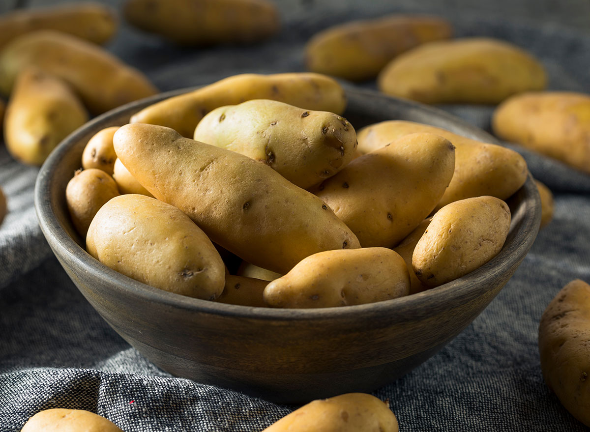 raw yellow fingerling potatoes in bowl