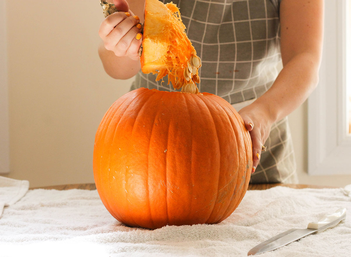 Taking off the top of a pumpkin