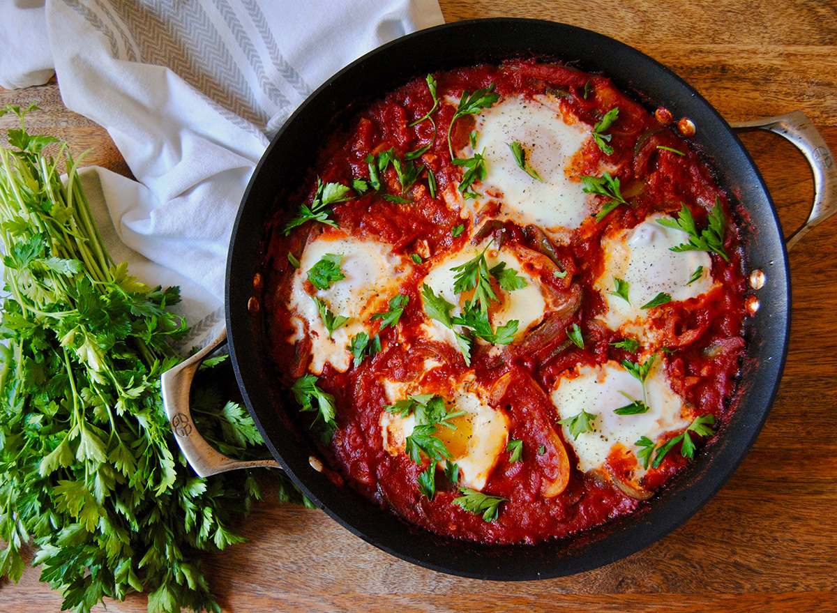 Paleo casserole shakshuka dish in a skillet with parsley