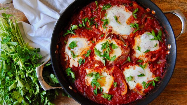 Paleo casserole shakshuka dish in a skillet with parsley
