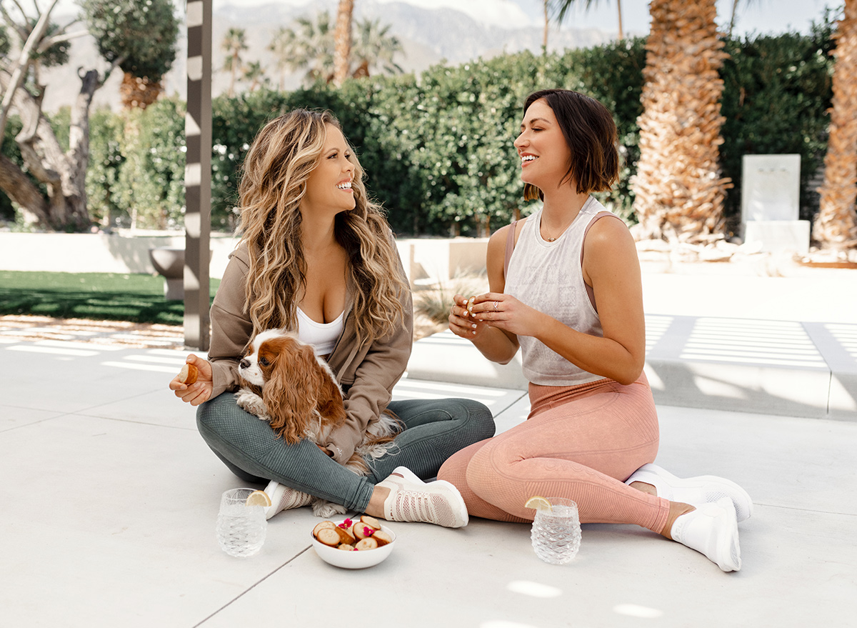 Tone It Up founders eating some baked goods after a workout