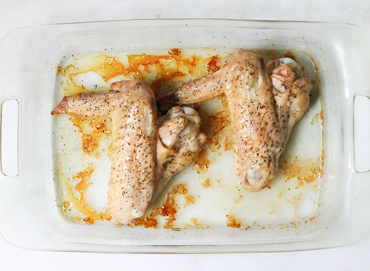 Baked turkey wings right as they are finished cooking in the casserole dish
