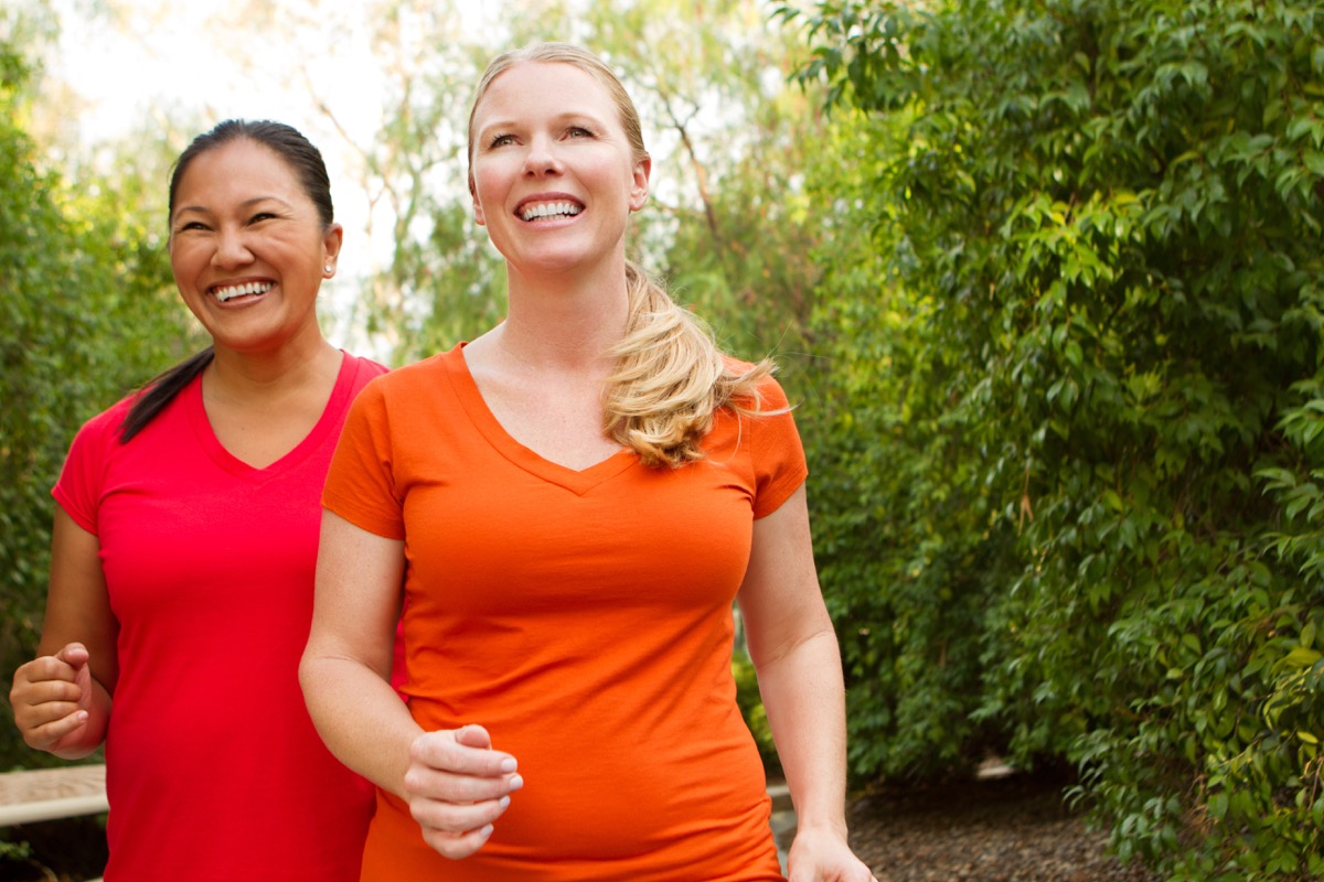 Women walking and exercising, smiling and happy