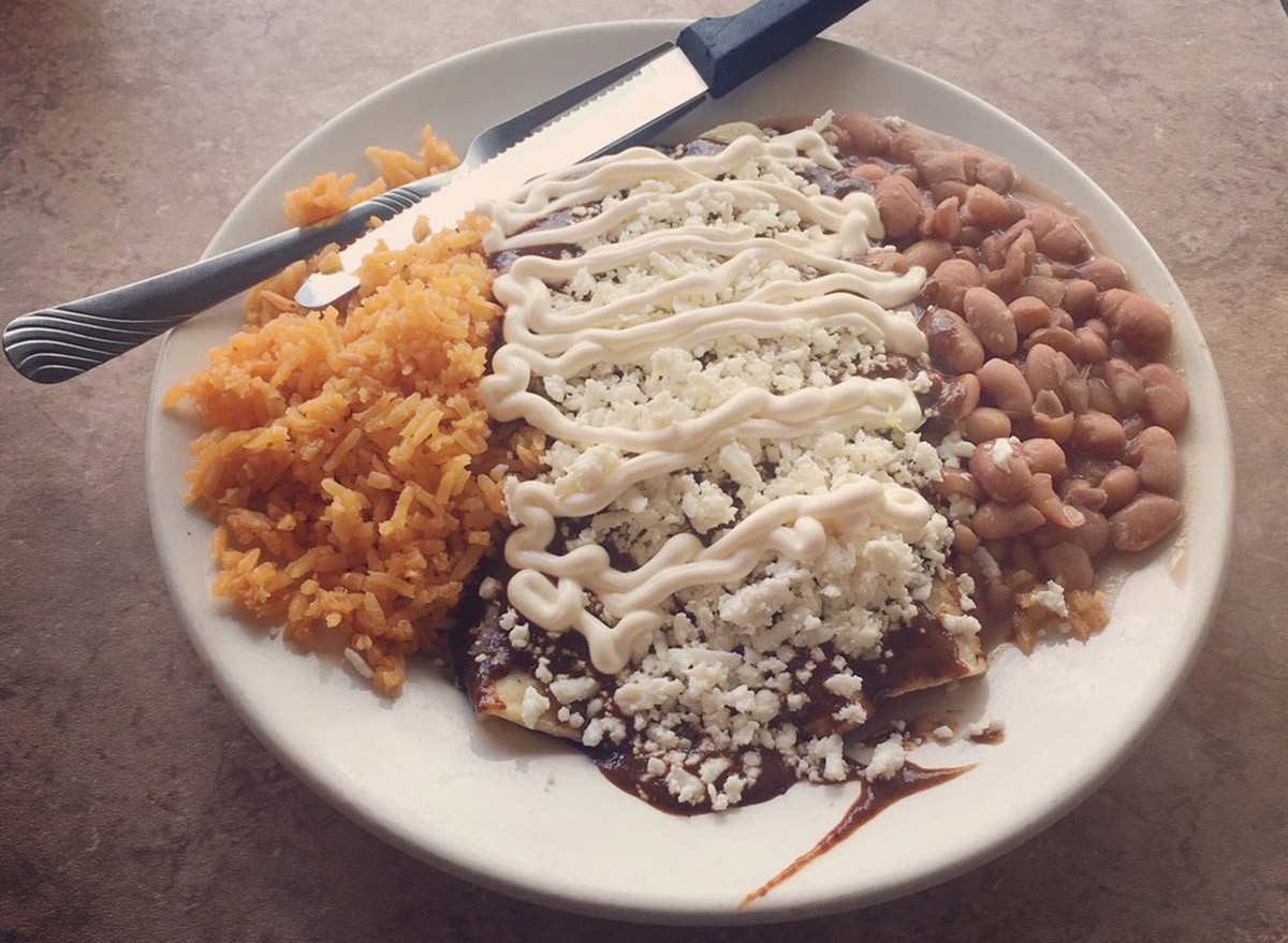 Alambama Antojitos Izcalli enchiladas, beans and rice