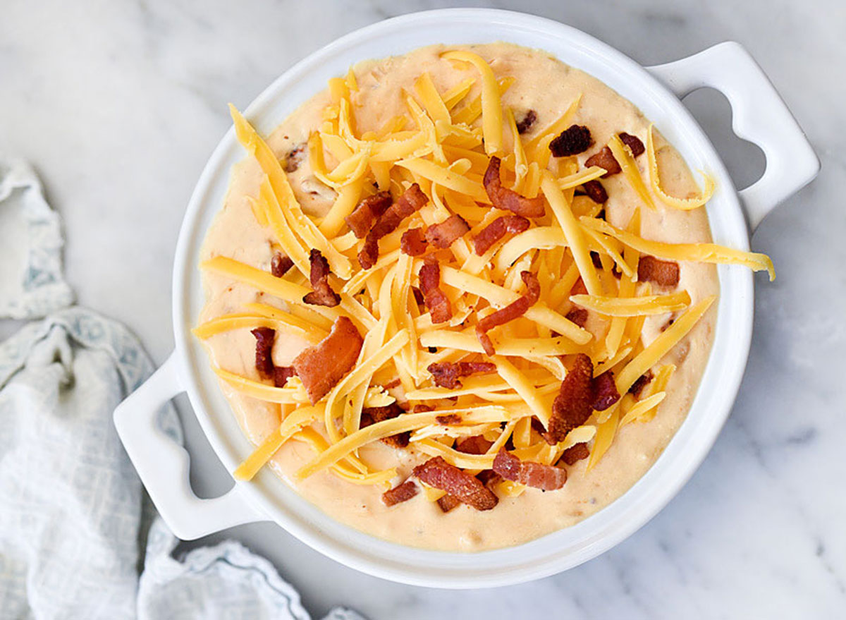 bacon beer cheese dip in pot on marble table