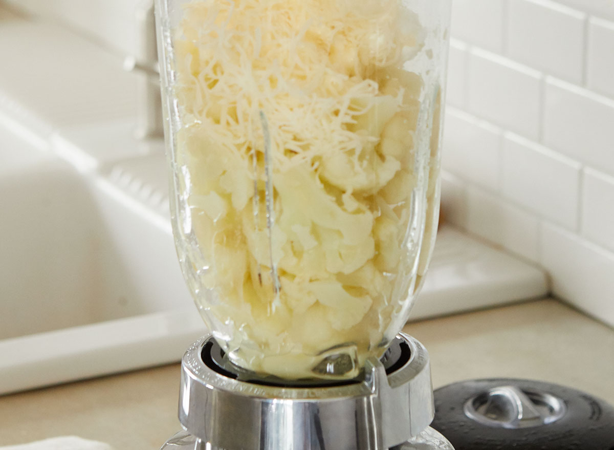 Blending cauliflower and cheese to make cauliflower mash