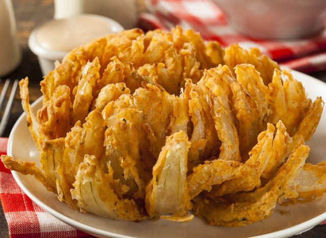 bloomin onion on white plate