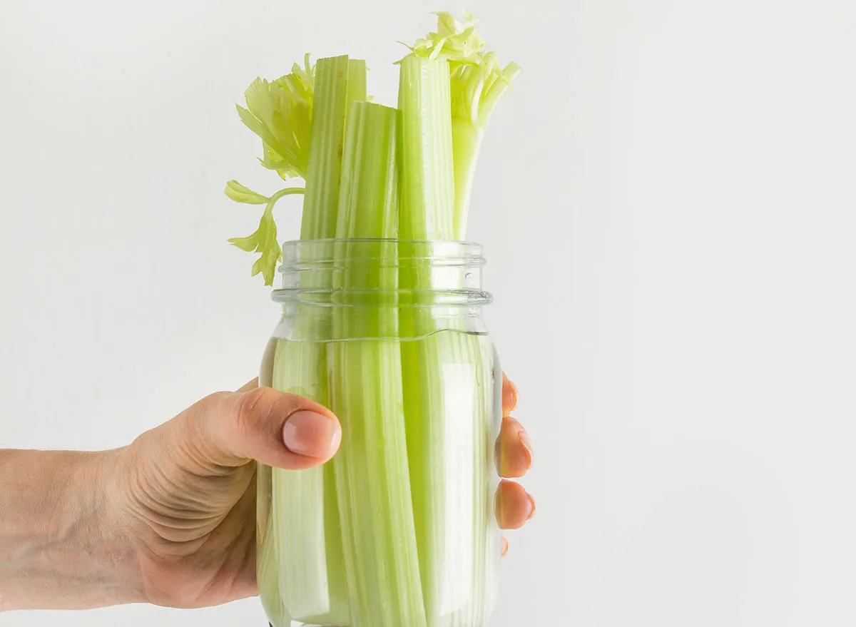 Celery stored in a jar with water