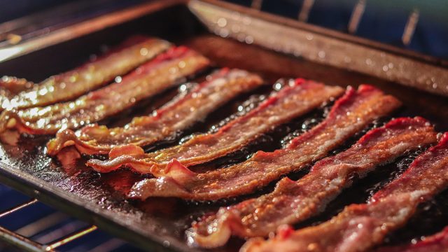 crispy bacon on a pan on grill