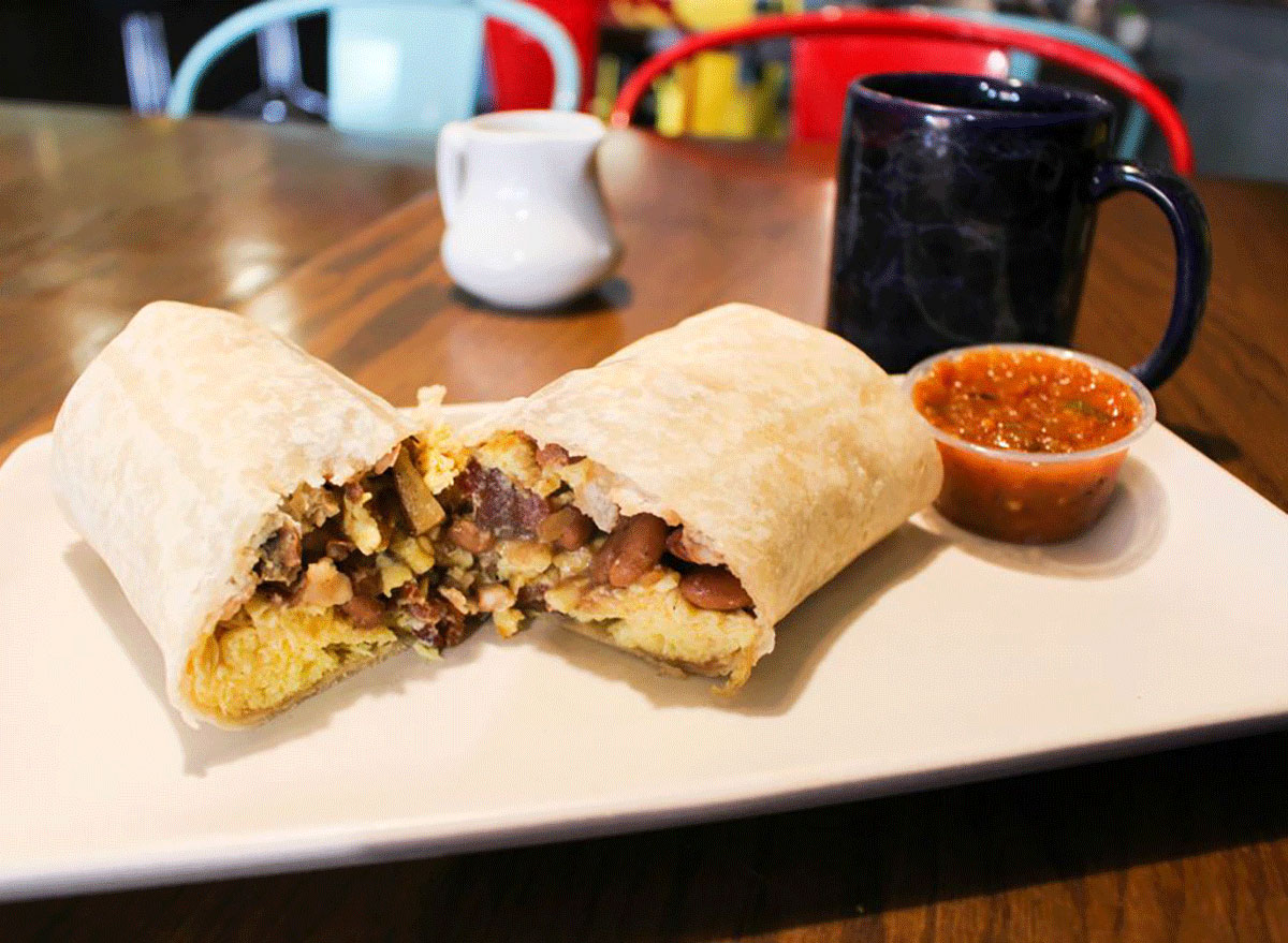 breakfast burrito on a plate with salsa from the joy bus diner