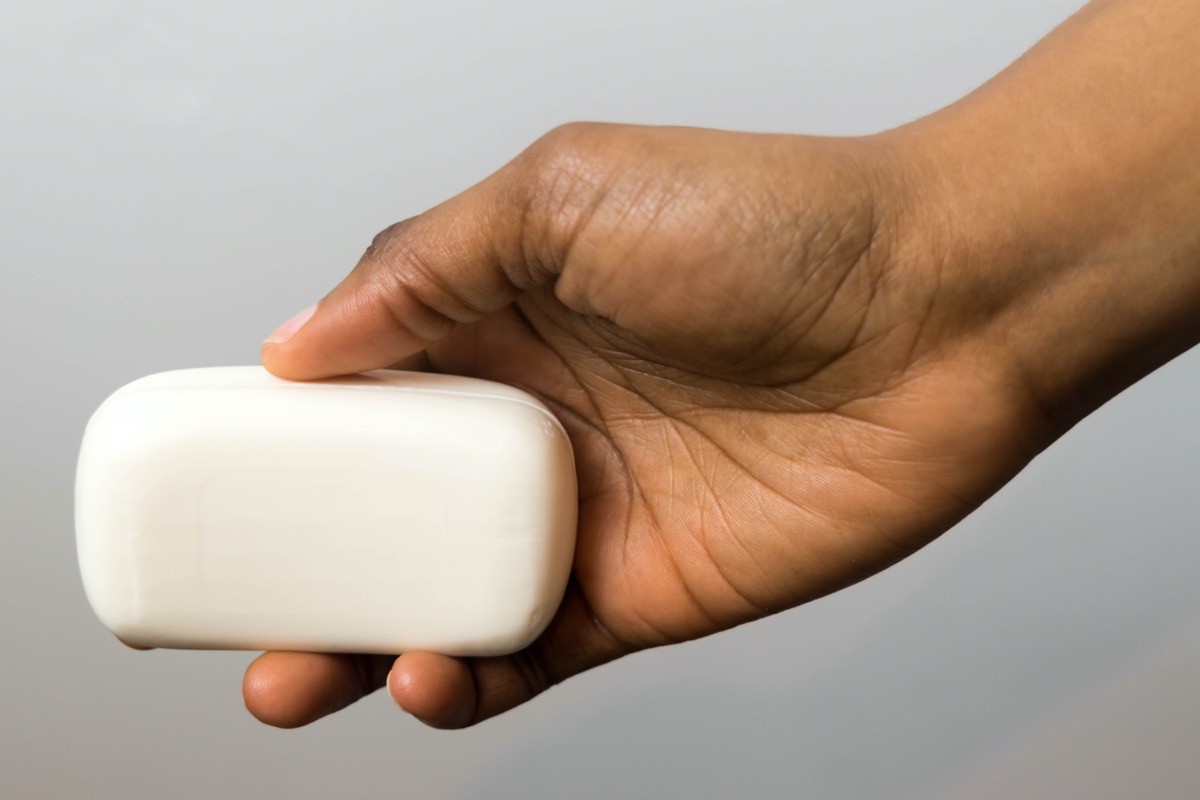 woman hands with soap bar
