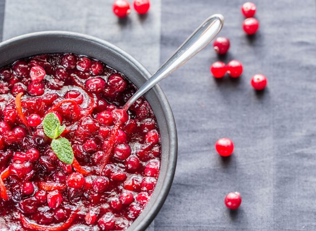 homemade cranberry sauce with cranberries outside the bowl
