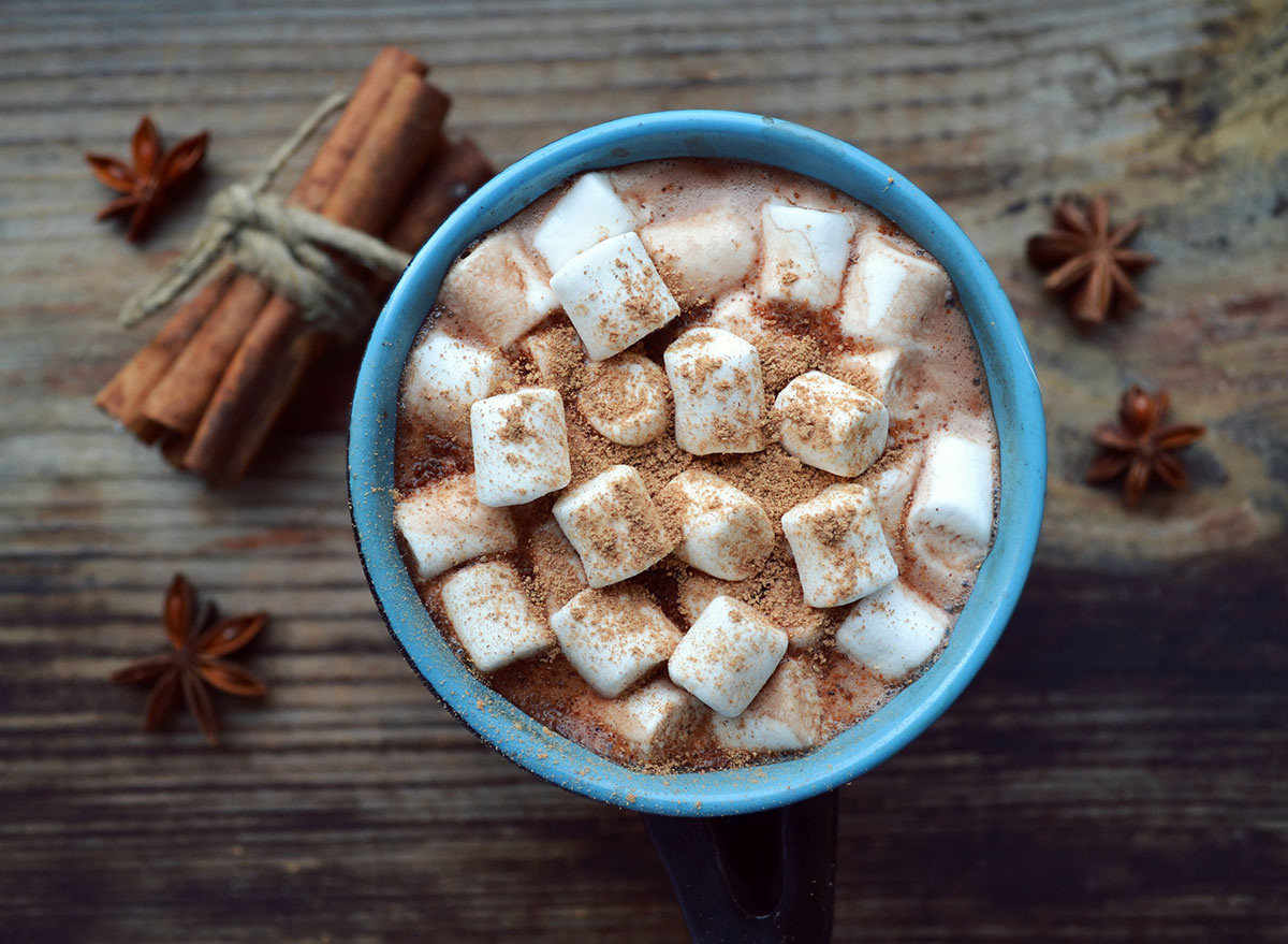 hot chocolate with marshmallows and cinnamon in a blue mug