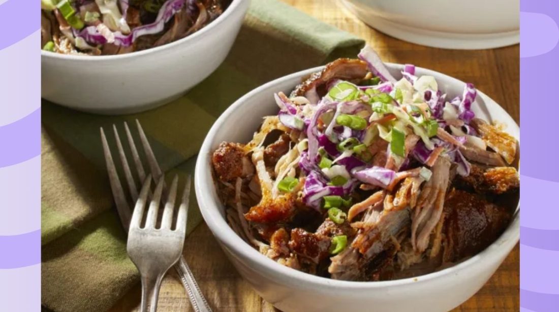 bowl of pulled pork on a purple background