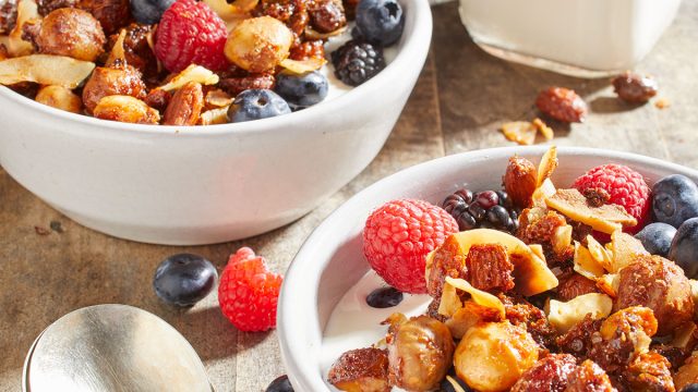 Keto nut and granola recipe in a bowl with fruit and milk