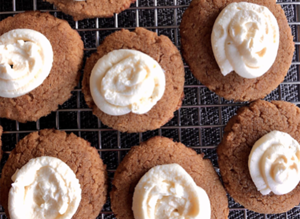 keto pumpkin cookies cream cheese frosting on a cooling rack
