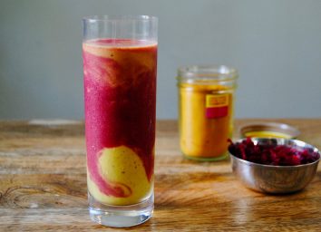paleo fruit smoothie in glass on wooden surface