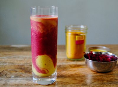 paleo fruit smoothie in glass on wooden surface