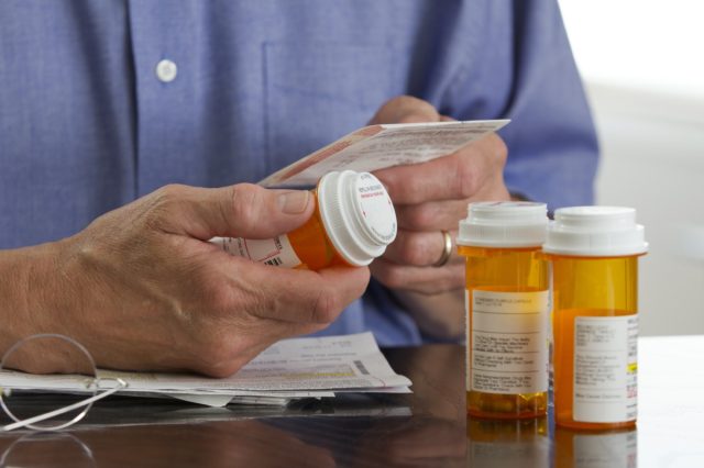 man with prescription medications