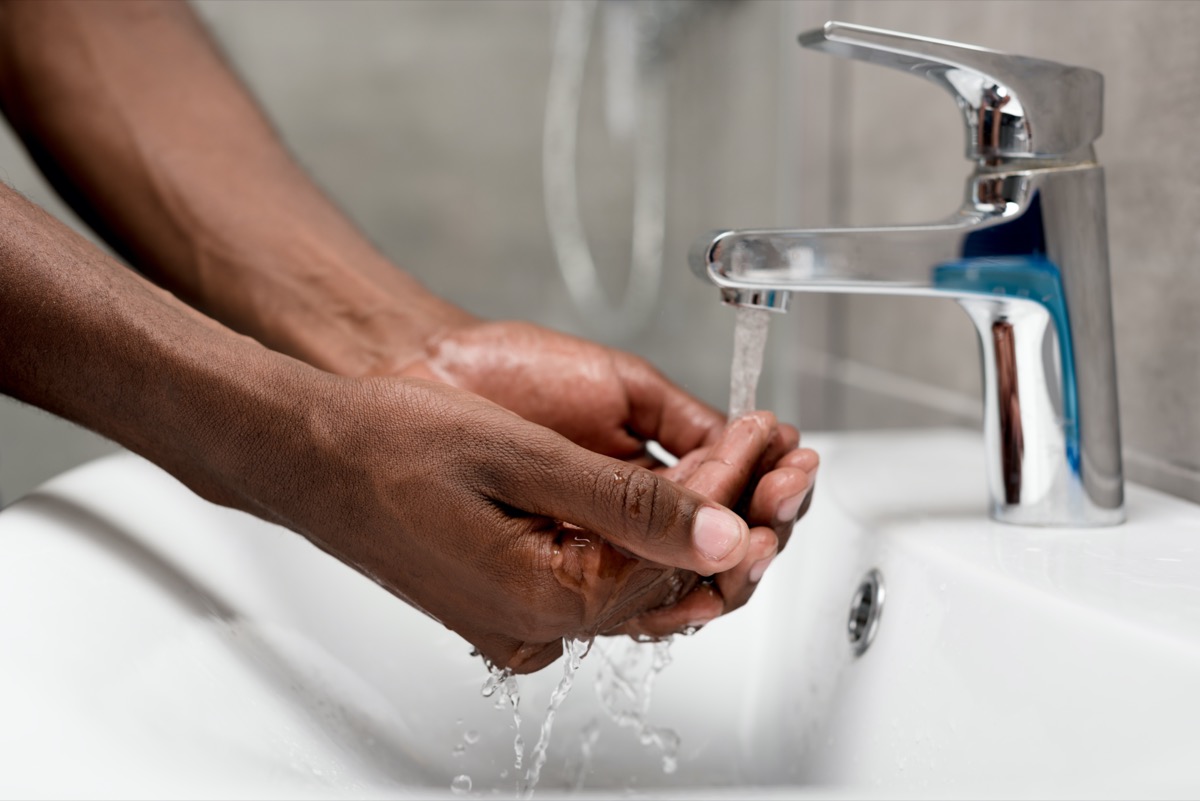 man washing in bathroom