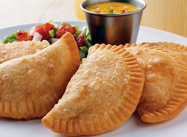 on the border ground beef empanadas with side salad and sauce