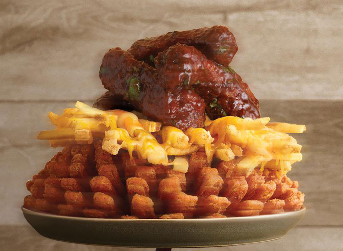 outback steakhouse three point rib bloom with bloomin onion topped wtih cheese fries topped with ribs