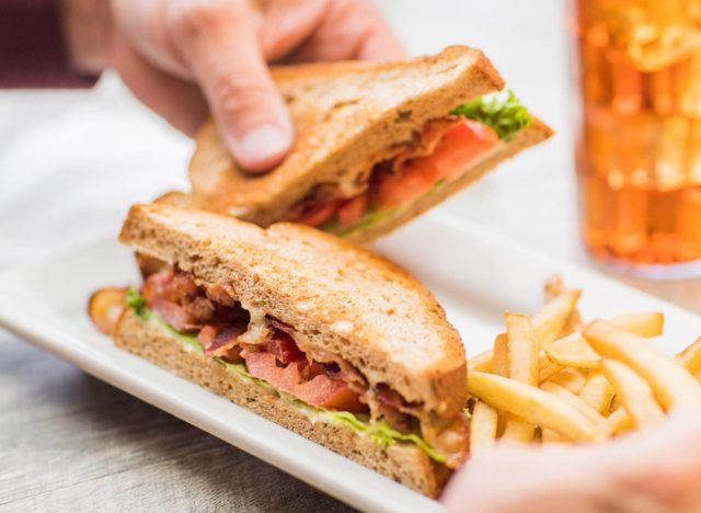 big blt from perkins on a plate with french fries