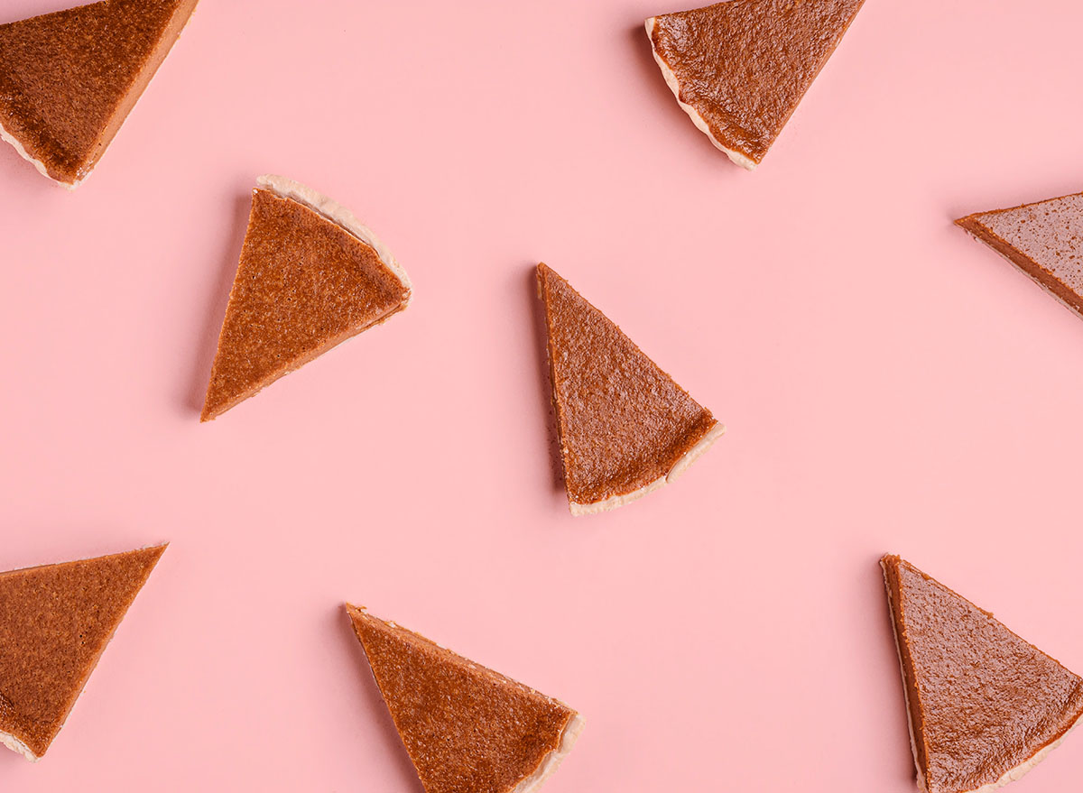 pumpkin pie slices on pink backdrop