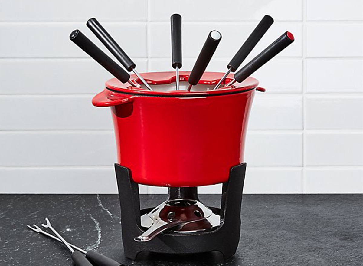 red fondue set on black countertop
