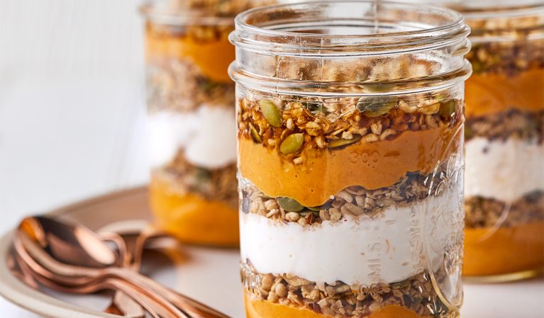 spicy pumpkin parfait in a mason jar with spoons